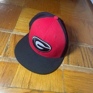 University of Georgia red and black snapback hat.